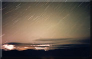 Star trails in sicamous during a storm